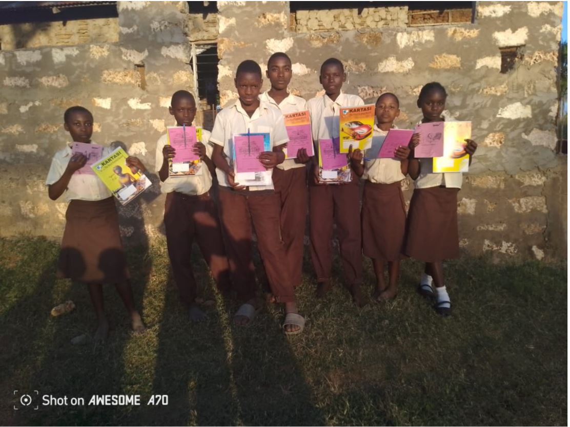 Children receiving school books